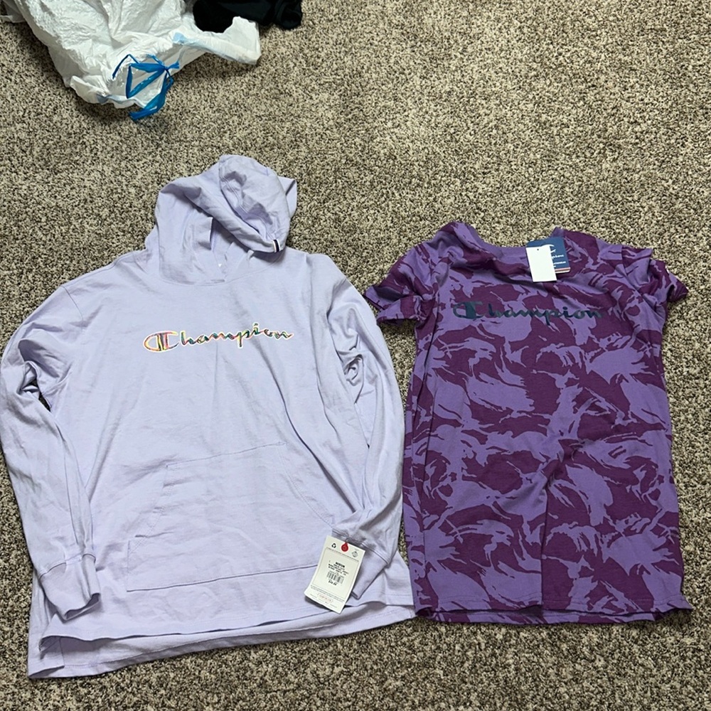 Two women’s champion shirts new with tags.